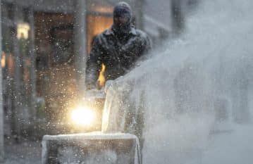 Man Blowing Snow