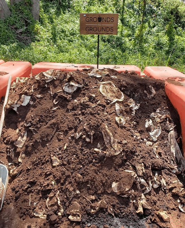 A compost heap with coffee grounds added to it