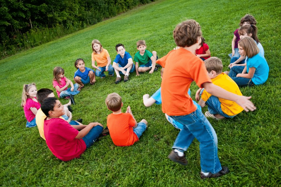 Kids playing Duck Duck Goose