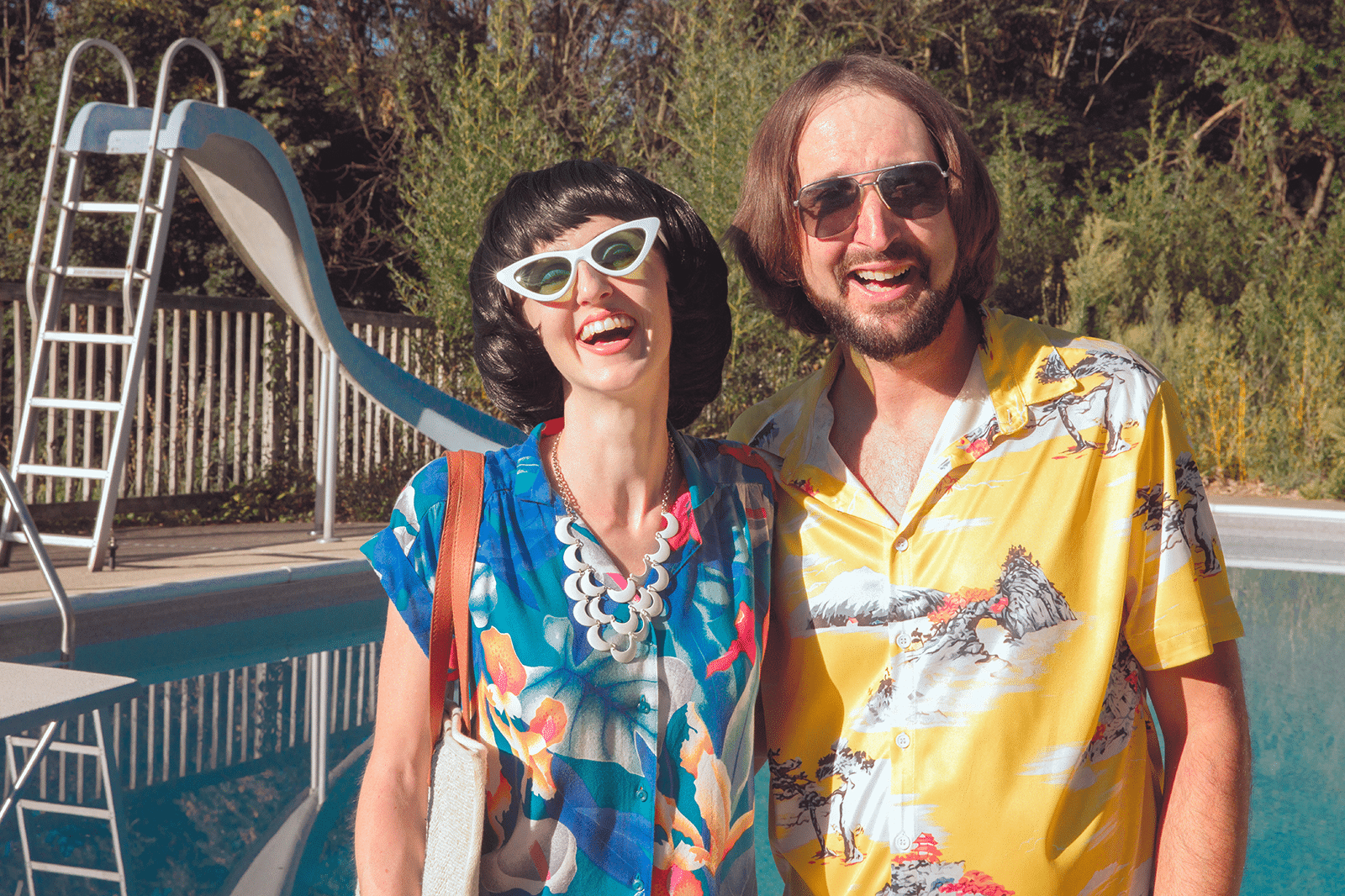 A couple dressed in '70s party outfits, ready to dance the night away